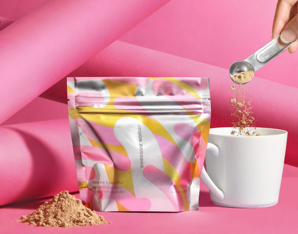 pink powder stand up pouch pouring in a drink